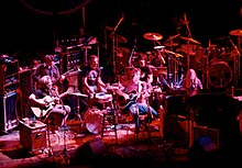 An acoustic performance at the Warfield Theatre in San Francisco in 1980. Left to right: Garcia, Lesh, Kreutzmann, Weir, Hart, Mydland. Grateful Dead at the Warfield-02.jpg