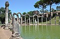 The so-called Canopus at Hadrian's Villa in Tivoli lined with a colonnade carrying curved entablatures.