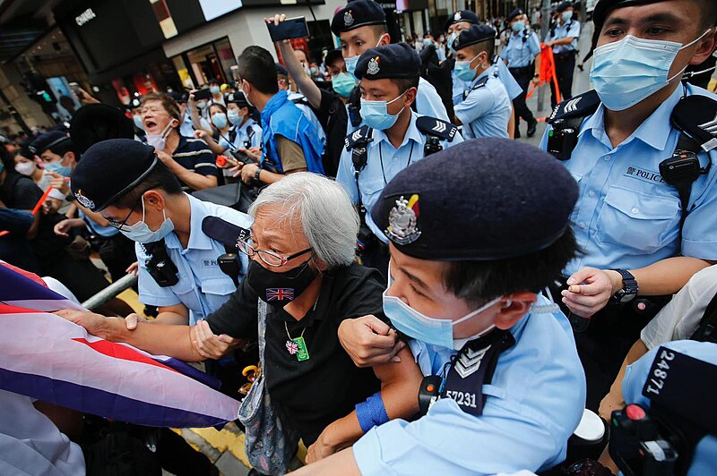 File:Hong Kong, 1 July March, 2021, Aunt Wong arrested by Police.jpg