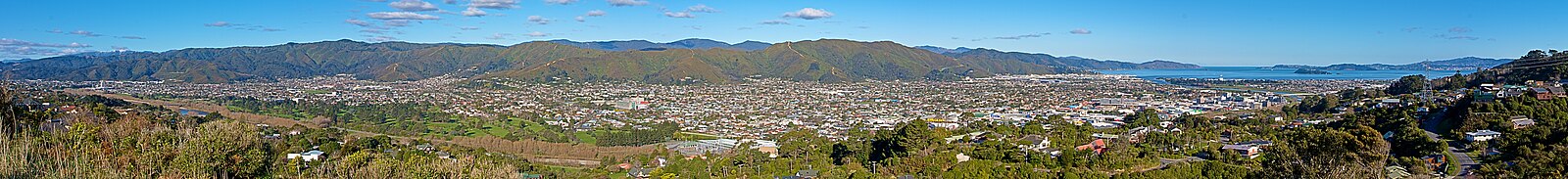 Wider view of the Lower Hutt valley. This view shows Wellington in the distance on the extreme right hand side. Past the Lower Hutt CBD in the centre of the photo, and onto Avalon and Taitā on the left-hand side.