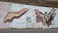 Сучасне вуличне мистецтво острова Ікарія з зображенням падаючого Ікара неподалік села Евділос на Ікарії, Греція