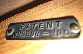 Label inside a drawer from a Harris Lebus mahogany Sheraton style wardrobe made in 1907, with the registration number 8896-1904 for the 1904 patent for the panelled drawer lining design.jpg