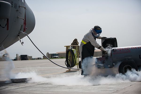 A U.S. Air Force technician transfers liquid oxygen to a Lockheed Martin C-130J Super Hercules aircraft at the Bagram Airfield, Afghanistan.