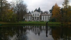 Manor house in Podstolice from afar.JPG