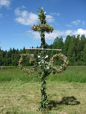 A Maypole with wreaths, raised for Midsummer celebrations in Östra Insjö, Dalarna, Sweden