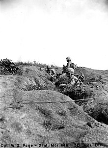 3rd Battalion, 21st Marines on Iwo Jima. 24 February, 1945 Men of "L" Company, 3rd Battalion, 21st Marines, moving forward under heavy mortar and machine gun fire in attempt to take -2 airstrip. Iwo Jima. 24 February, 1945. (53409103603).jpg