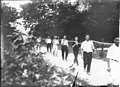 Miami University freshman-sophomore tug-of-war participants carrying rope 1914 (3191493406).jpg