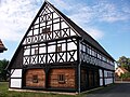 Schwarzbach open-air museum: residential stable house (formerly OT Doberenz, Dorfstraße 25), side building with upper arbor (former OT Leupahn, Hauptstraße 7), forge (former OT Königsfeld, Hauptstraße 11 - now Hauptstraße 15), small stable (formerly the municipality of Königshain- Wiederau, OT Königshain, Dorfstraße 209) and residential stable with surrounding area (formerly the Rochlitz community, Poppitz district, Mühlenstraße 7) as well as a long-column construction from Altgeringswalde (formerly Untere Dorfstraße 67 - still stored) as part of the Schwarzbach open-air museum