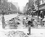 James Patrick Lee (1894-1963), Noordelijk zicht op de herbestrating van 2nd Ave. Seattle, Washington, 1914.