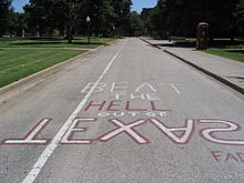 Reminder for OU students of rivalry with the dates of every game for the past 20 years. With construction of a new pedestrian mall, this painting was replicated outside Nielsen Hall close to the clock tower in front of Bizzell Library. Until May 2006, it was located at the South Oval. OUSouthOvalBeatTexas.jpg