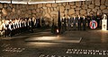 President George W. Bush listens to the Ankor Children's choir during his visit to the Hall of Remembrance at Yad Vashem.jpg