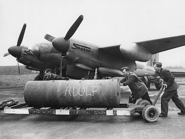 A 4,000-lb HC bomb, marked "Happy Xmas Adolf" being loaded onto a de Havilland Mosquito of No. 128 Squadron RAF
