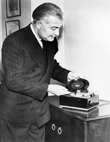 Arthur Fiedler demonstrates the new RCA Victor 45rpm player and record in February 1949.