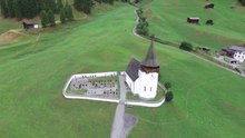 File: Reformed church of Davos Frauenkirch, aerial video.webm