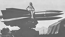 Renee Rockett sits atop the Hawk missile on a launcher assembly.jpg