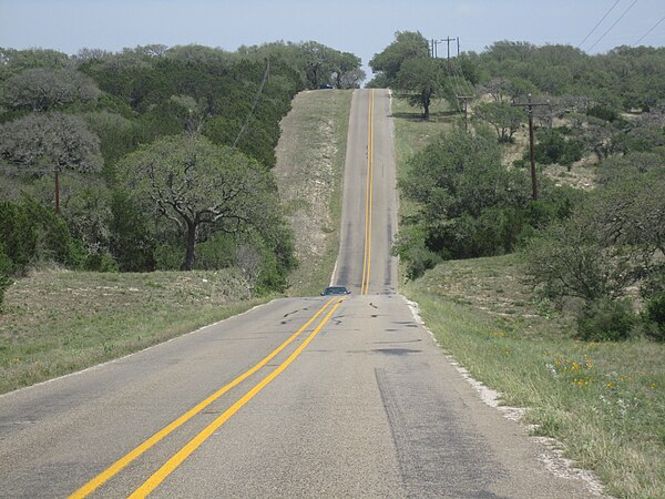 Rolling highway in Burnet County in Texas Hill Country toward Longhorn Cavern State Park