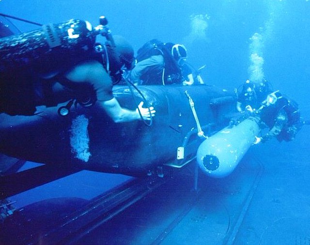 US Navy SEALs deploy a torpedo-armed Mark 9 SDV from a submarine
