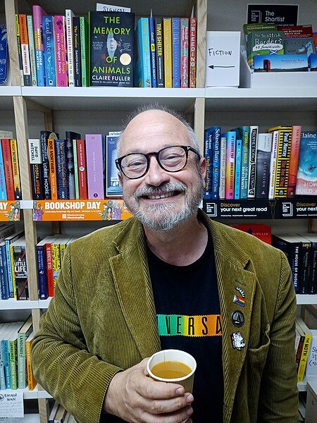 Ince talking to a room of 35 people at Heron and Willow bookshop, Jedburgh, Scotland, 2023