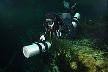 Sidemount diver pushing a cylinder in front Sidemount 032 Photo by Pete Nawrocky.jpg