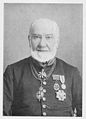 Sir Albert Woods wearing the collor around his neck and the star.