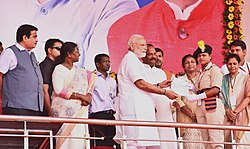 The Prime Minister, Shri Narendra Modi distributing the Certificate of Appointment to constables of Paharia Special India Reserve Batallion, at a function, at Sahibganj, Jharkhand.jpg