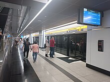 The platform 4 (Kwasa Damansara bound) of the TRX Station which serve the Putrajaya Line. Tun Razak Exchange MRT Station platform 4 (230319).jpg