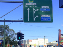 An outdated sign on Northcott Drive reflecting the centre's former name Westfield Kotara Sign.png