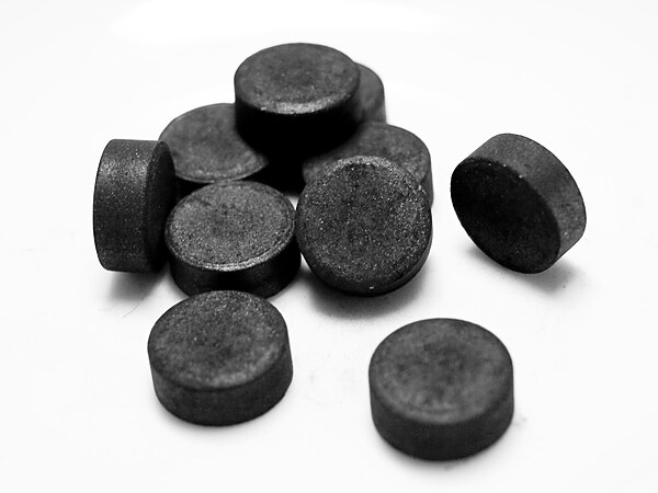 Ivory black or bone char, a natural black pigment made by burning animal bones.