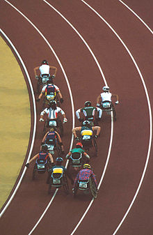 View from above of wheelchair racing competition at the 2000 Summer Paralympics 141100 - Athletics wheelchair racing racers from above 2 - 3b - 2000 Sydney race photo.jpg