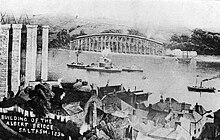 Royal Albert Bridge: the first span and centre pier under construction in 1854, seen from Saltash 1854 at the Royal Albert Bridge - sinking the central pier.jpg