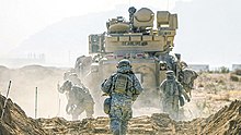 JWA 19, Yakima Training Center, Wash., May 6, 2019. Soldiers of 1st Battalion, 17th Infantry Regiment, 2nd Stryker Brigade Combat Team, 2nd Infantry Division heading toward their mission objective. 1st Battalion, 17th Infantry Regiment, 2nd Stryker Brigade Combat Team, 2nd Infantry Division JWA 19, Yakima Training Center, May 2019.jpg