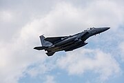 An F-15E Strike Eagle, tail number 01-2003, taking off from RAF Lakenheath in England. The aircraft is assigned to the 494th Fighter Squadron.