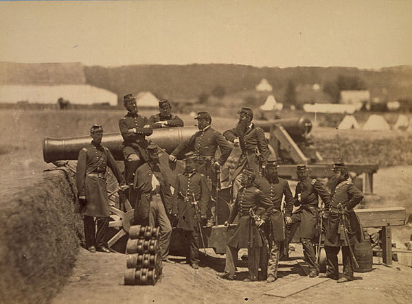 Officers of the 69th New York Volunteer Regiment with a cannon at Fort Corcoran in 1861. Michael Corcoran at left