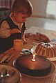 A young child preparing to extinguish the candle of his first birthday - 1983-11-30.jpg