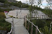 English: Rock art in the world heritage area in Alta, Norway. This is from the area Bergbukten 4b, a group of 195 figures. 22-24 m above sea level, and 6000-7000 years old.