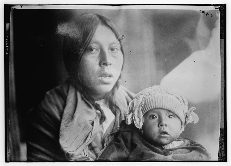 Native American woman holding her child