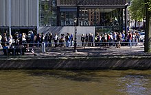 People waiting in line in front of the Anne Frank House entrance in Amsterdam AnneFrankMuseumLine.jpg