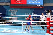 Deutsch: Boxen bei den Olympischen Jugendspielen 2018 Tag 12, 18. Oktober 2018 - Kampf um die Bronzemedaille im Fliegengewicht Mädchen – Heaven Destiny Garcia (USA, blau) schlägt Goryanana Stoeva (Bulgarien, rot) 5-0; Ringrichter ist Ishanguly Meretnyyazov (Turkmenistan). English: Boxing at the 2018 Summer Youth Olympics on 18 October 2018 – Girl's flyweight Bronze Medal Bout - Heaven Destiny Garcia (USA, blue) beats Goryanana Stoeva (Bulgaria, red) 5-0; Referee is Ishanguly Meretnyyazov (Turkmenistan). Español: Boxeo en los Juegos Olímpicos Juveniles de Verano de 2018 en 18 de octubre de 2018 - Combate a medalla de bronce de peso mosca para mujeres: Heaven Destiny Garcia (Estados Unidos, azul) le gana a Goryanana Stoeva (Bulgaria, roja) 5-0; El árbitro es Ishanguly Meretnyyazov (Turkmenistán).