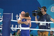 Deutsch: Boxen bei den Olympischen Jugendspielen 2018 Tag 12, 18. Oktober 2018 - Finale Fliegengewicht Mädchen – Martina La Piana (Italien, blau) schlägt Adijat Gbadamosi (Nigeria, rot) 5-0; Ringrichter ist James Beckles (Trinidad und Tobago). English: Boxing at the 2018 Summer Youth Olympics on 18 October 2018 – Girl's flyweight Gold Medal Bout - Martina La Piana (Italy, blue) beats Adijat Gbadamosi (Nigeria, red) 5-0; Referee is James Beckles (Trinidad and Tobago). Español: Boxeo en los Juegos Olímpicos Juveniles de Verano de 2018 en 18 de octubre de 2018 - Combate a medalla de oro de peso mosca para mujeres: Martina La Piana (Italia, azul) le gana a Adijat Gbadamosi (Nigeria, roja) 5-0; El árbitro es James Beckles (Trinidad y Tobago).