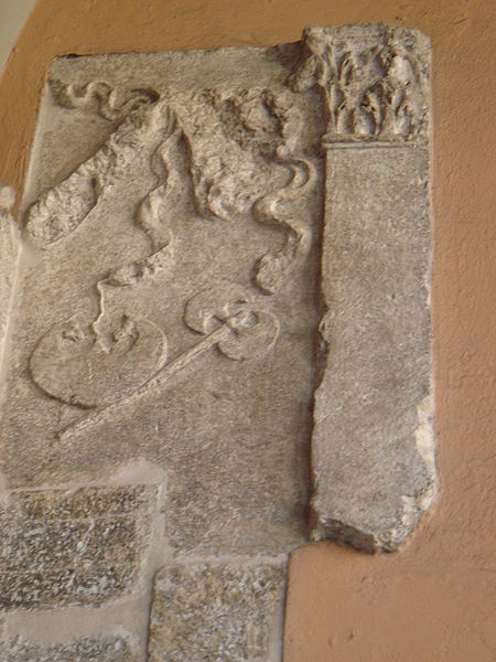 Roman axes in an ancient Roman relief in Brescia, Italy