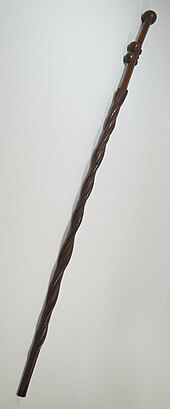 Brooklyn Museum 22.198 Cane / This cane is from the Arts of Africa collection. Bantu-Kongo people in Central Africa and African Americans in the United States crafted similar canes. Historians noted similar meanings and religious use of canes between African and African-American people as they carved animals and human figures onto canes to conjure illness. The difference with African-American canes is North American animals are carved onto canes and historical events are carved about sharecropping and lynchings. Brooklyn Museum 22.198 Cane.jpg