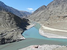 Zanskar River meeting the Indus Confluence of blue Zanskar and grey Indus, Ladakh.jpg