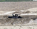 Destroyed Iraqi tank near road 2003-03-25