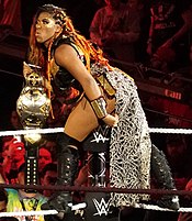 Ember Moon with the second design of the NXT Women's Championship belt (2017-2022). Ember Moon NXT Women's Champion.jpg