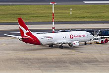 A Boeing 737-400SF branded for Australia Post at Melbourne Airport in 2020. Express Freighters Australia (VH-XNH) Boeing 737-400SF at Sydney Airport (2).jpg
