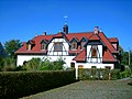 Hauffe nursery (formerly);  Farm building of a former estate with enclosure including portal