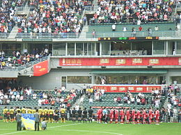 2007 Hong Kong League XI (those in red jersey) HK Stadium football teams national song on.JPG