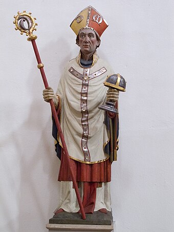 Bishop Godehard with the reliquary in a statue from around 1450 in the basilica of St. Godehard Hildesheim St. Godehard Statue Godehard.JPG