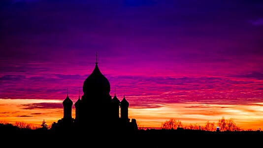 Silhouette of the Holy Trinity church (Latvia) at sunset