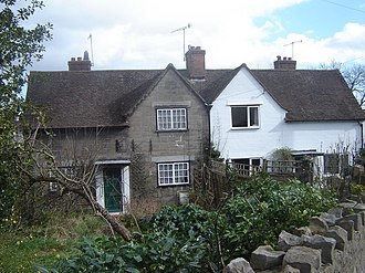 Houses built for National Shipyard staff at Hardwick "Garden City", Chepstow: the one on the left retains the original windows and lack of rendering House with original features, Garden City, Chepstow - geograph.org.uk - 352394.jpg